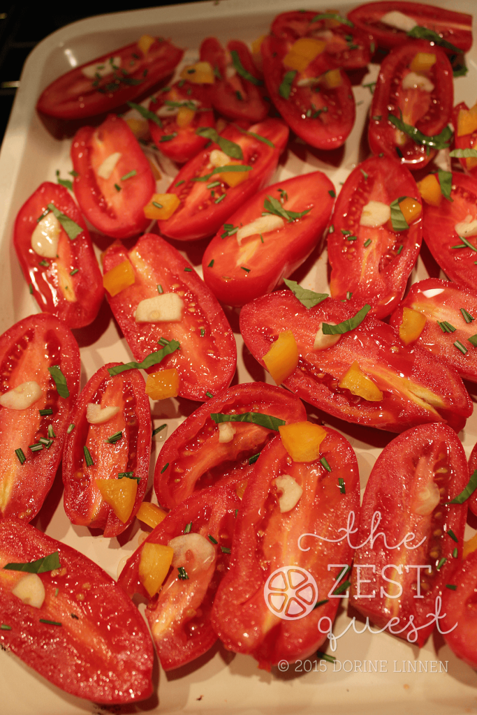 Roasted-Tomatoes-before-roasting-on-ceramic-pans-with-pepper-basil-rosemary-garlic-2-The-Zest-Quest